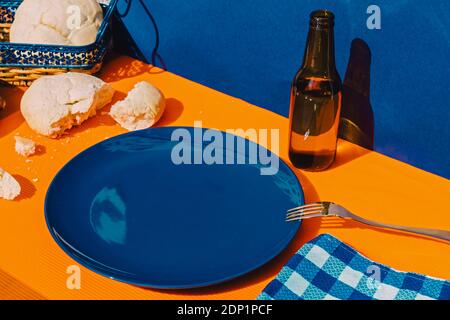 Bread, bottle of beer and empty plate Stock Photo