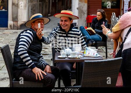 Two Gondoliers Taking A Selfie, Venice, Italy. Stock Photo