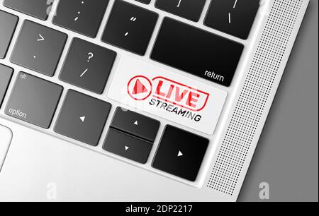 Dedicated live internet streaming key on a black computer keyboard, concept picture of global communications and modern technologies Stock Photo