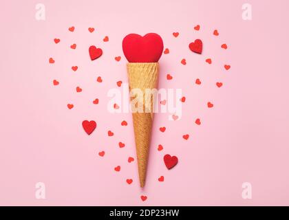Happy Valentine's Day.Red heart in ice cream cone on a pink background.Valentine day concept Stock Photo
