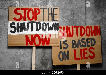 Protestive placard against coronavirus lockdowns against wall Stock Photo