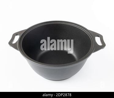 Black cast iron pan on a light background Stock Photo