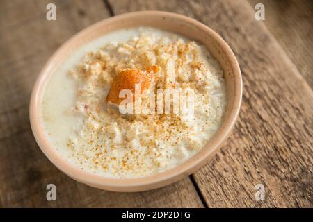 A bowl of crab soup made from a brown crab, Cancer pagurus, and brown rice, milk and cream. England UK GB Stock Photo