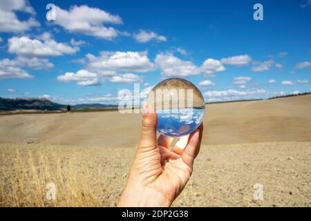 At San Quirico d'Orcia - Italy - On august 2020 - landscape of Val d'Orcia in a crystal ball, Tuscany Stock Photo
