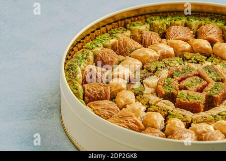 Traditional turkish, arabic sweets baklava assortment in metal box. Closeup Stock Photo