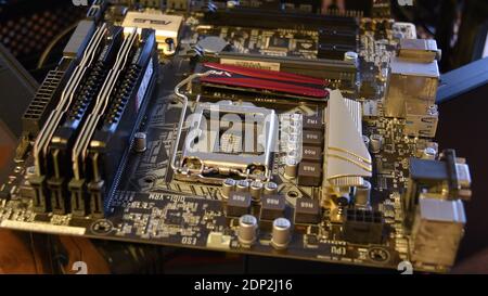 Closeup of modern PC motherboard hardware with empty space for CPU. Computer technology background. Odessa, Ukraine, 12 13 2020 Stock Photo