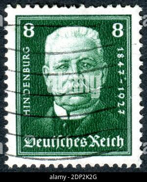 GERMANY - CIRCA 1928: A stamp printed in Germany (Deutsches Reich), shows a portrait of the President of the German Reich Paul von Hindenburg, circa 1928 Stock Photo