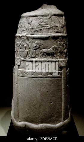 Ancient Near East. Unfinished kudurru. A horned serpent, symbol of the god Marduk, is coiled round the base. White limestone. Kassite period, 12th century BC. Found in Susa, Iran. Louvre Museum. Paris. France. Stock Photo