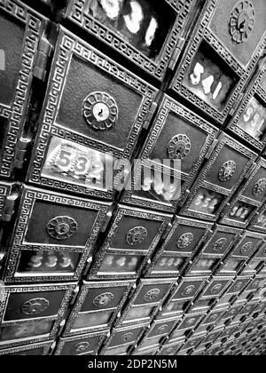 Post Office Boxes in the old Post Office in New York City.  Very dramatic angle with wide angle lens, making for a vanishing point perspective. Stock Photo