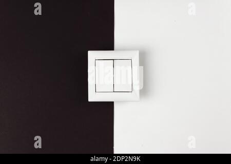 Double switch on paper black and white background. Energy Saving, power, electrical and lifestyle concepts Stock Photo
