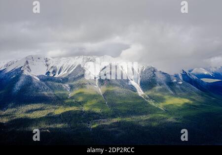 Forested mountains and valley under low clouds, near Banff, Alberta, Canada. Stock Photo