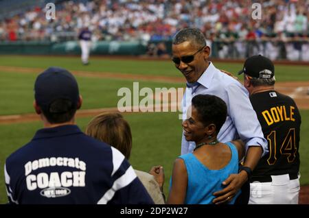 US President Barack Obama greets Congresswoman Donna Edwards D-MD while Minority Leader Nancy Pelosi (2L) looks during the 2015 Congressional Baseball Game at the National Parks Stadium, in Washington, DC, USA, on June 11, 2015. Photo by Aude Guerrucci/Pool/ABACAPRESS.COM Stock Photo