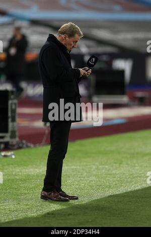 London, UK. 16th Dec, 2020. Harry Redknapp looks at his phone. Premier League match, West Ham Utd v Crystal Palace at the London Stadium, Queen Elizabeth Olympic Park in London on Wednesday 16th December 2020. this image may only be used for Editorial purposes. Editorial use only, license required for commercial use. No use in betting, games or a single club/league/player publications. pic by Steffan Bowen/Andrew Orchard sports photography/Alamy Live news Credit: Andrew Orchard sports photography/Alamy Live News Stock Photo