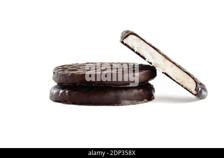 Stack of dark chocolate covered candies with a creamy peppermint filling and missing bite. Isolated over a white background with clipping path include Stock Photo