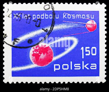 MOSCOW, RUSSIA - SEPTEMBER 15, 2018: A stamp printed in Poland shows Earth and Sputnik, 60th Anniversary of the October Revolution serie, circa 1977 Stock Photo