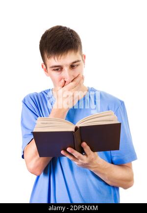 Surprised Young Man read a Book Isolated on the White Background Stock Photo