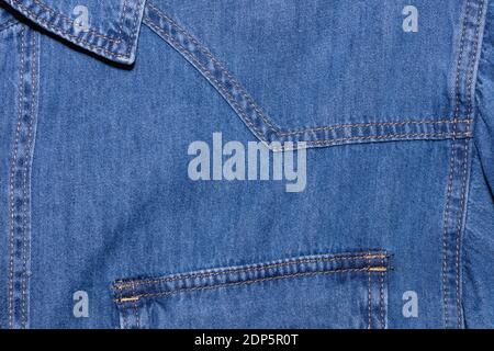 Close up shot of blue denim jeans shirt. Clothing store and shopping concepts. Stock Photo