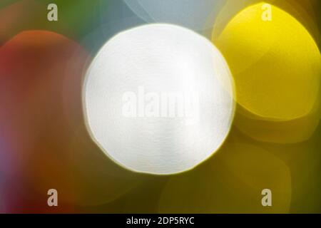 Happy New Year ornament decorations, colorful defocused abstract blurry bokeh background. Out of focus Xmas holiday lights, celebration texture Stock Photo