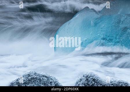 Blocks of ice in waves at Diamond beach, Jökulsárlón, Austurland, Iceland, Northern Europe Stock Photo