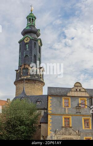 The tower of Schloss Weimar peeking over the surrounding houses, seen from the Green Market Stock Photo
