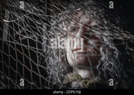 Frightened mermaid caught In fishing nets. Black and white Stock