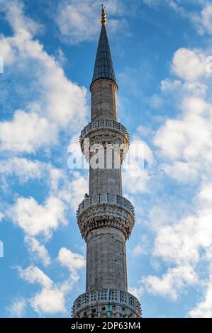 One of six minarets of Sultan Ahmed Mosque or Sultan Ahmet Camii, also known as the Blue Mosque with blue sky Stock Photo