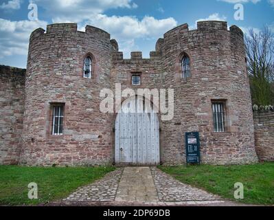 Closed wooden gates at an entrance to the medieval Beeston Castle, standing on Beeston Crag, 107m above the Cheshire Plain in England, UK. Stock Photo