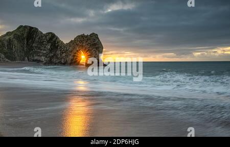 Durdle Door sunrise on the Jurassic coastline, Dorset. UK Stock Photo