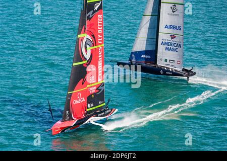 (201219) -- AUCKLAND, Dec. 19, 2020 (Xinhua) -- New York Yacht Club American Magic (R) compete against Emirates Team New Zealand during the third day's competition at the America's Cup World Series in Auckland, New Zealand, Dec. 19, 2020. (COR36/Studio Borlenghi/Handout via Xinhua) Stock Photo