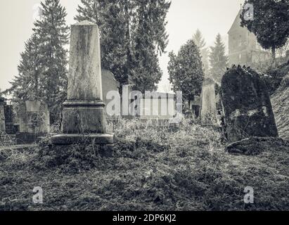 Graves and tombstones in the cemetery located near Church on the Hill in Sighisoara. Stock Photo