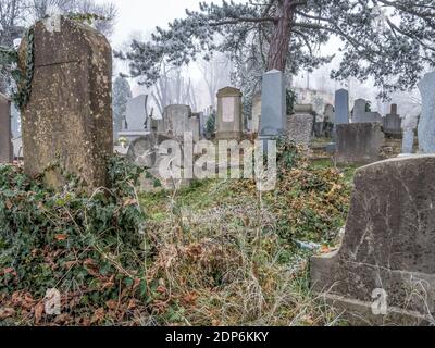 Graves and tombstones in the cemetery located near Church on the Hill in Sighisoara. Stock Photo