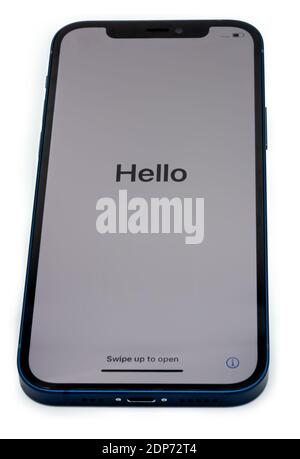 Ostfildern - Germany, December 5, 2020: Apple iPhone 12 in blue colour with slight shadows on perfectly white background. The phone is showing the Stock Photo