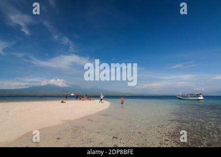 The tourists arrive at Tabuhan Island, one of the marine tourism destinations in Banyuwangi district. Stock Photo