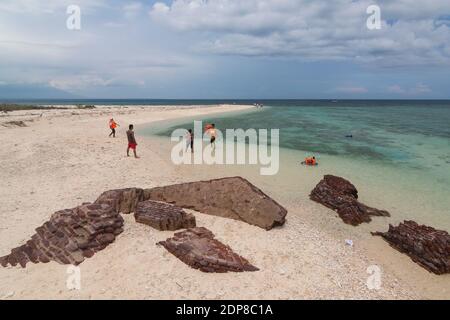 The tourists arrive at Tabuhan Island, one of the marine tourism destinations in Banyuwangi district. Stock Photo