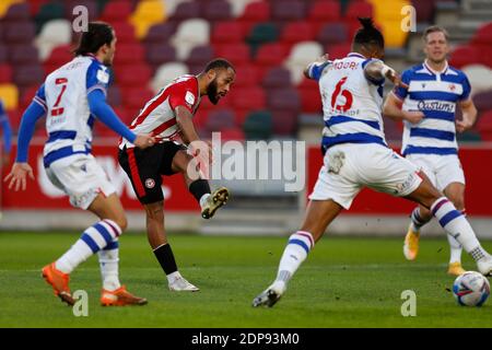 Brentford Community Stadium, London, UK. 19th Dec, 2020. English Football League Championship Football, Brentford FC versus Reading; Bryan Mbeumo of Brentford shoots past Liam Moore of Reading and scores his sides 3rd goal in the 29th minute to make it 3-0 Credit: Action Plus Sports/Alamy Live News Stock Photo