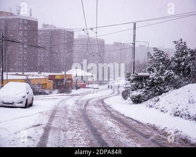 Heavy snowfall in the city - fresh tracks in the snow Stock Photo