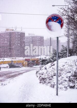 Heavy snowfall in the city - Traffic sign(no stopping)half-covered with snow Stock Photo