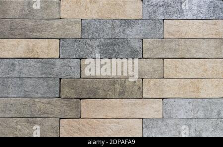 Decorative finishing stone. Texture of a rough stone wall. Background of natural stone. Stock Photo