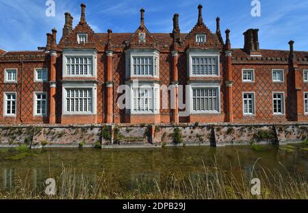 Helmingham Hall Suffolk red brick windows and chimneys. Stock Photo