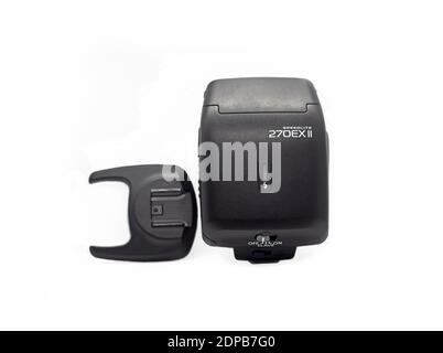Professional photo camera flash light isolated on white background. Stock Photo