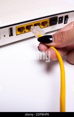 Internet modem and ethernet cable connection Stock Photo