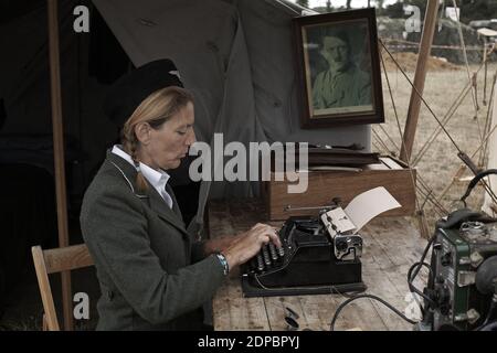 GREAT BRITAIN /England /woman wearing nazi uniform at the war and peace reenactment show . Stock Photo