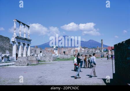 Archive scan of ruins of Pompeii comune destroyed by eruption of Mount Vesuvius in AD 79.  The Forum, Mount Vesuvius in the background. May 1968. Stock Photo