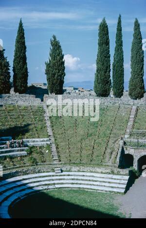 Archive scan of ruins of Pompeii comune destroyed by eruption of Mount Vesuvius in AD 79.  Large Theatre, audience sitting area. May 1968. Stock Photo