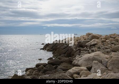 rocks, sea and blue sky with clouds in Spain Stock Photo