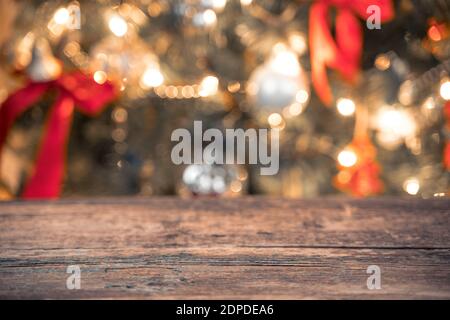 Blurry Christmas background with decorated Christmas tree and lights. Stock Photo