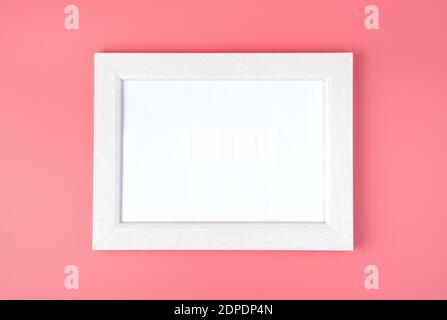 White frame with space to copy, on a pink background. Stock Photo