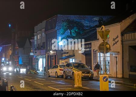 Swansea, UK. 19th Dec, 2020. A man walks past the Dark Horse pub in the small village of Mumbles near Swansea this evening ahead of Wales national lockdown from midnight tonight due to the rising number of Coronavirus cases in Wales and the rest of the UK. Credit: Phil Rees/Alamy Live News Stock Photo