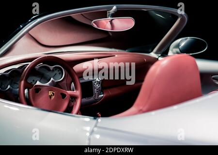 STUTTGART, Germany 6 March 2020: The Porsche Boxster Studie (cabrio) 1993 in Porsche Museum. Red leather interior, asymmetric rear-view mirror. Stock Photo