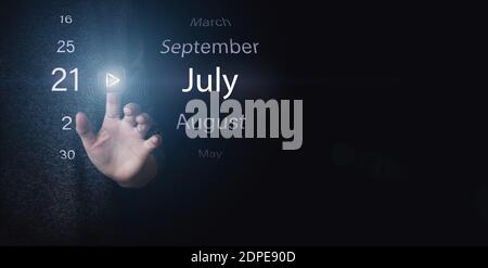 July 21st . Day 21 of month, Calendar date. Hand click luminous icon PLAY and DATE on dark blue background. Summer month, day of the year concept Stock Photo